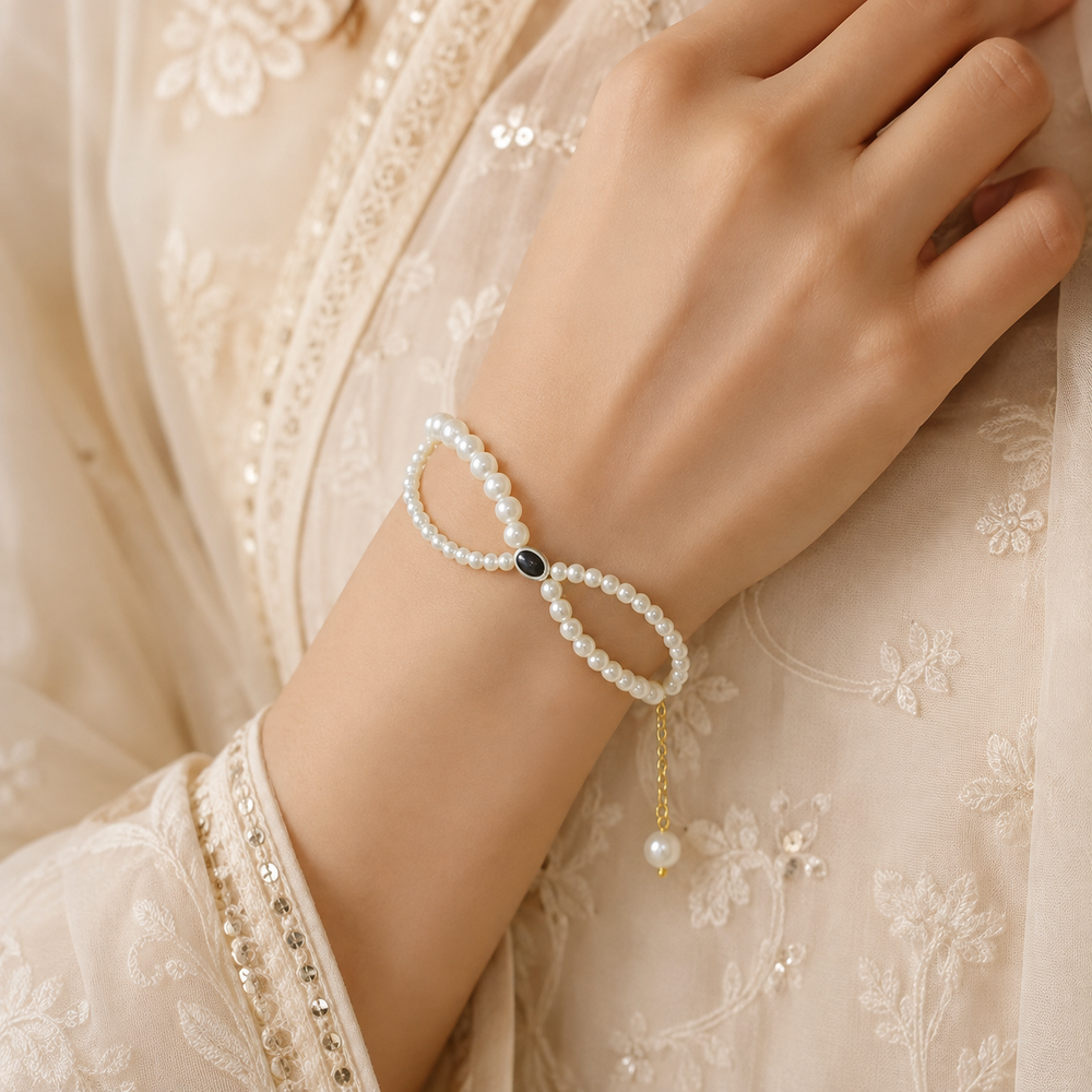 Elegant Pearl Bracelet with Gold Chain & Black Evil Eye Charm