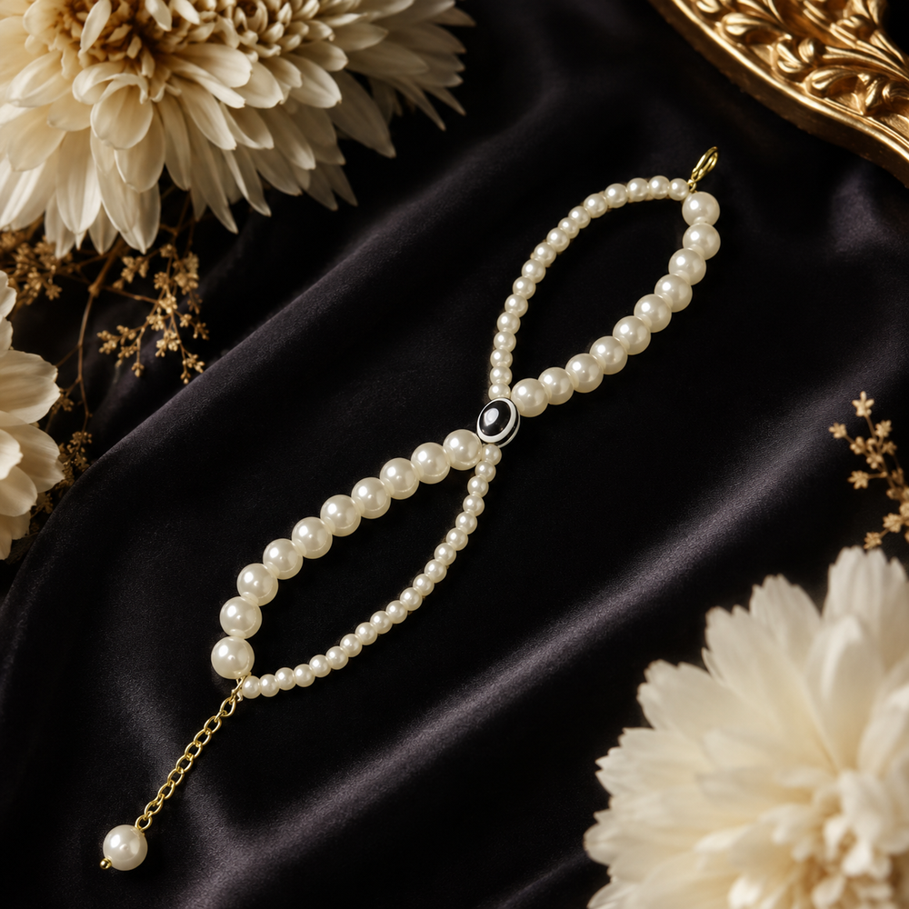 Elegant Pearl Bracelet with Gold Chain & Black Evil Eye Charm