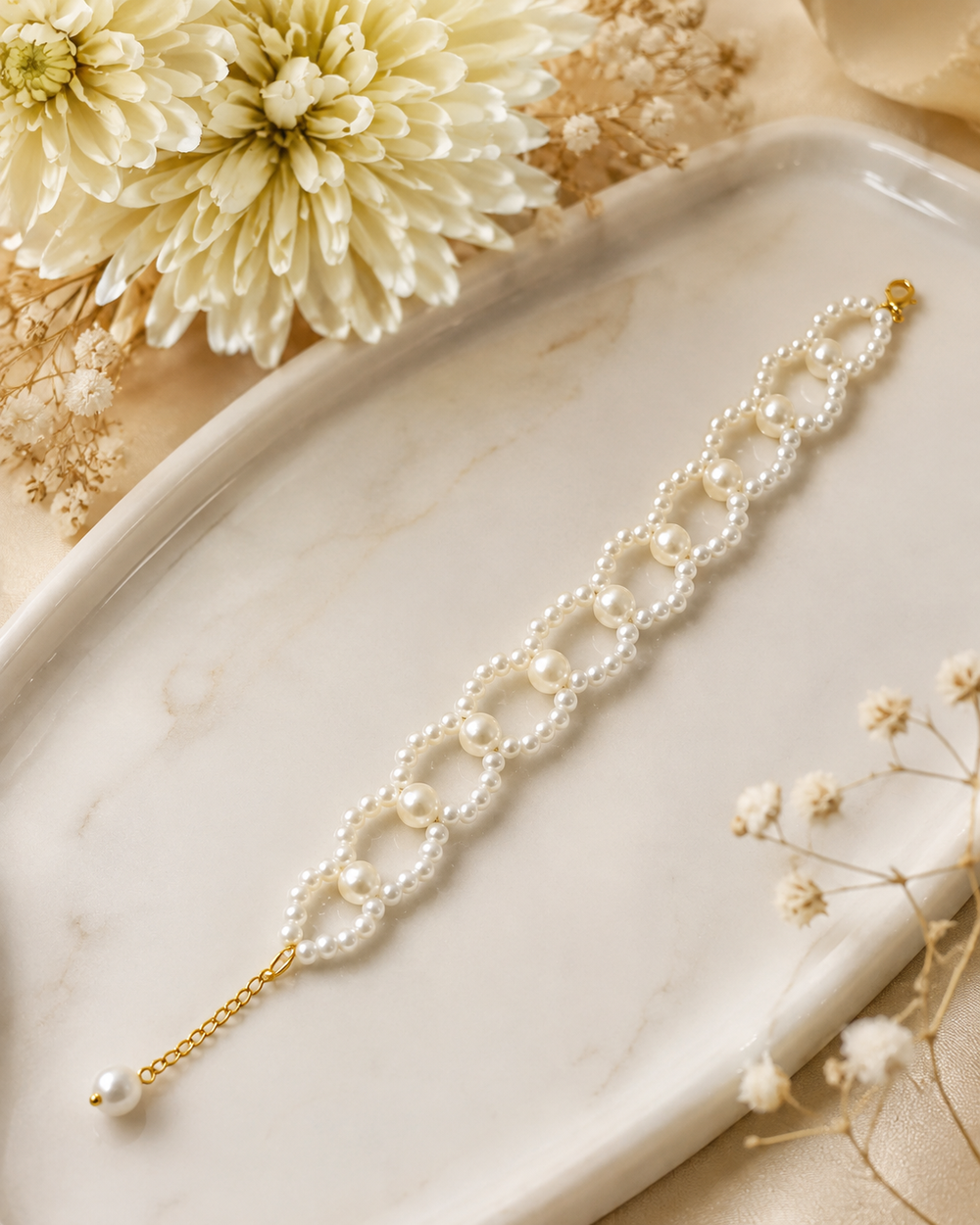 Elegant Pearl Bracelet with Gold Accents & Dangle Charm